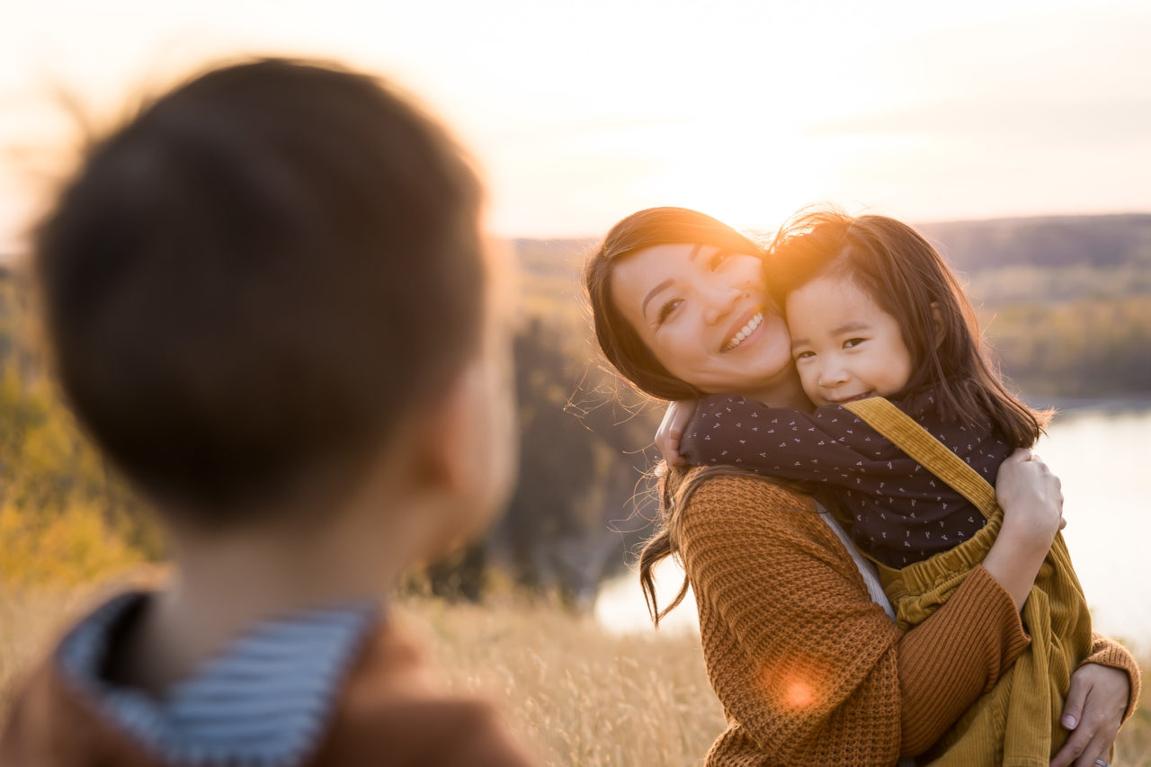 Edmonton outdoor Fall family photos - Mom hugging daughter - by Paper Bunny Studios