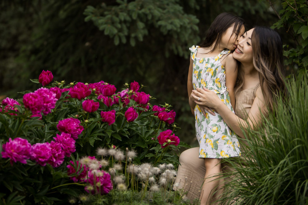 Outdoor family photography with mom and son & colour pop of flowers by Paper Bunny Studios Edmonton