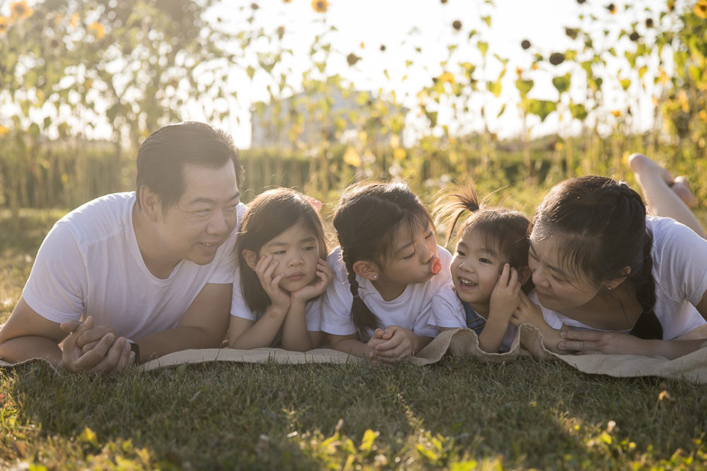 Edmonton Fall family photos in Sunflower field - family portrait by Paper Bunny Studios