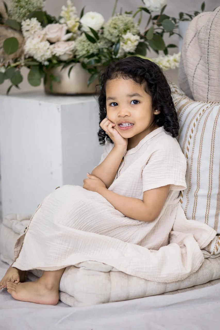 Portrait of a little girl being contemplative in studio by Edmonton family photographer Paper Bunny Studios