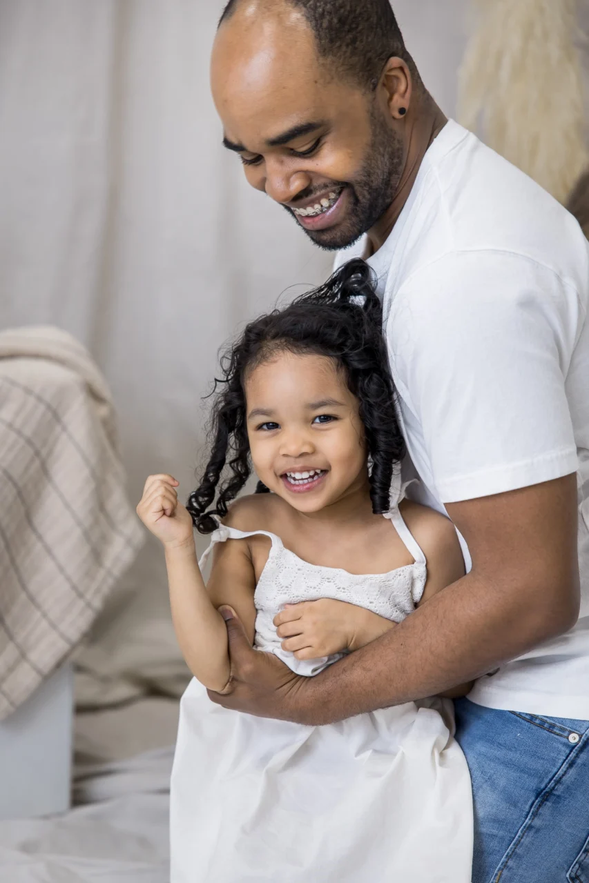 Dad & daughter laughing by Edmonton family photographer Paper Bunny Studios