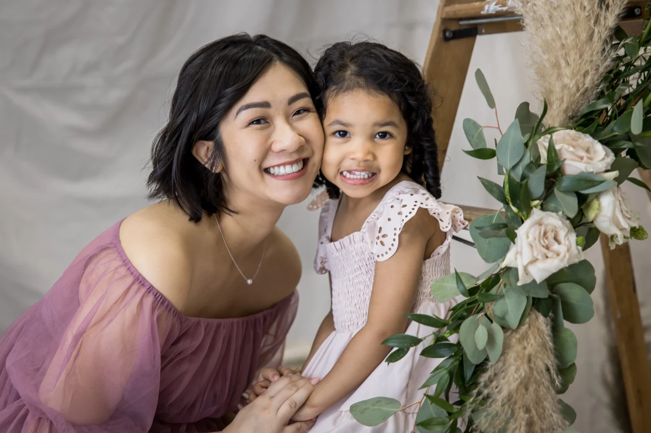 Cute cheek to cheek portrait of mom & daughter by Edmonton Family photographer Paper Bunny Studios