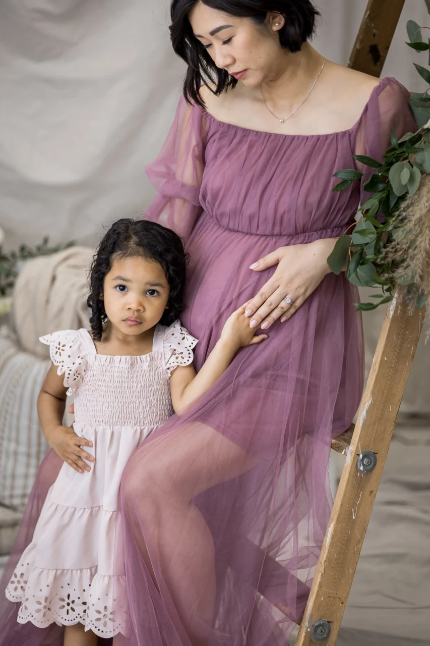 Elegant portrait of daughter leaning into mom by Edmonton Maternity photographer Paper Bunny Studios