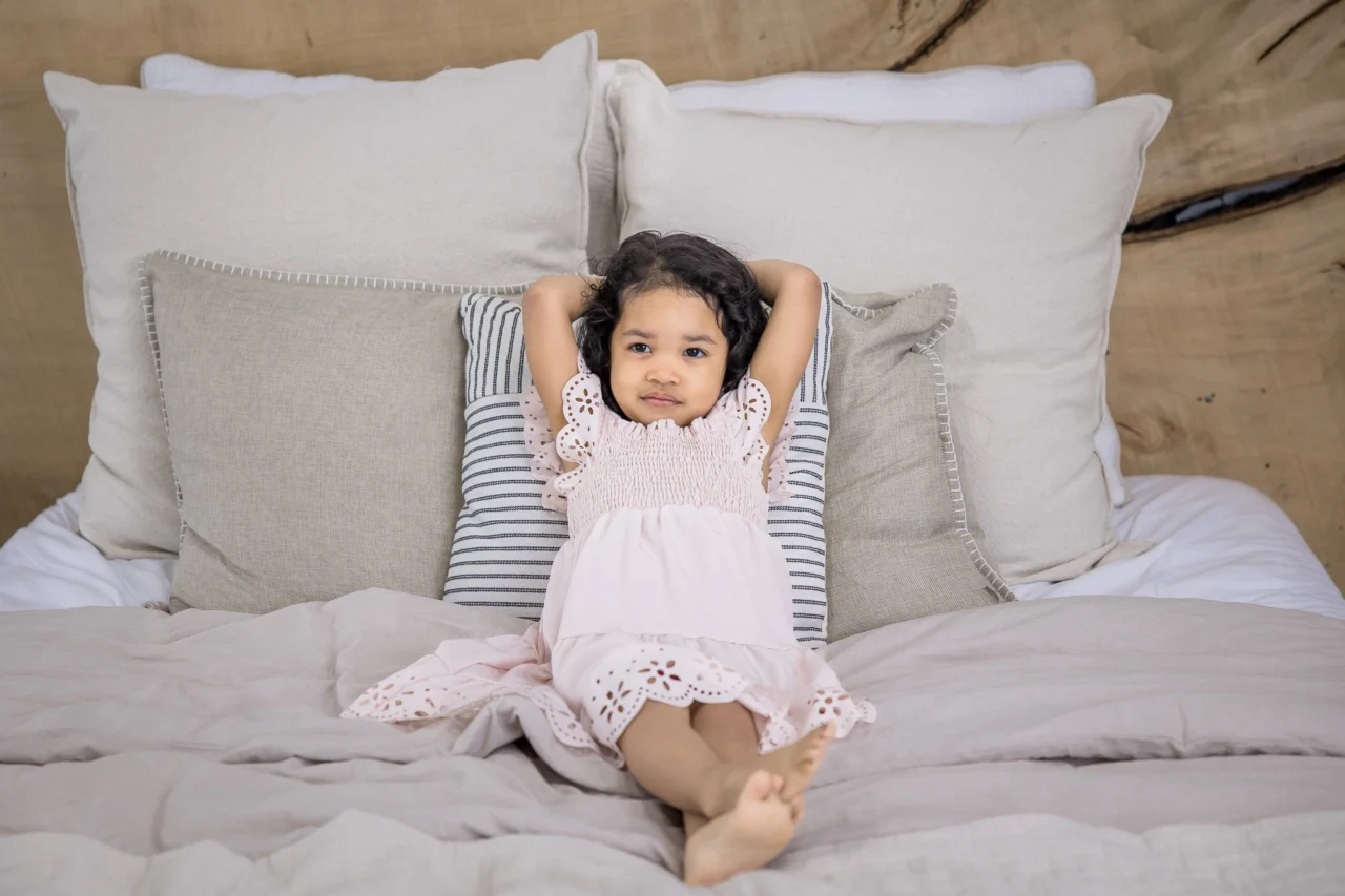 Little girl relaxing as part of family photo shoot by Edmonton Family photographer Paper Bunny Studios