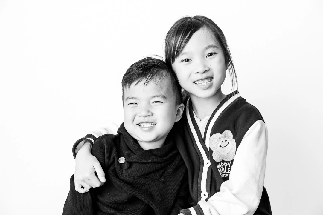 Black and white sibling photo by Paper Bunny Studios Edmonton family photographer