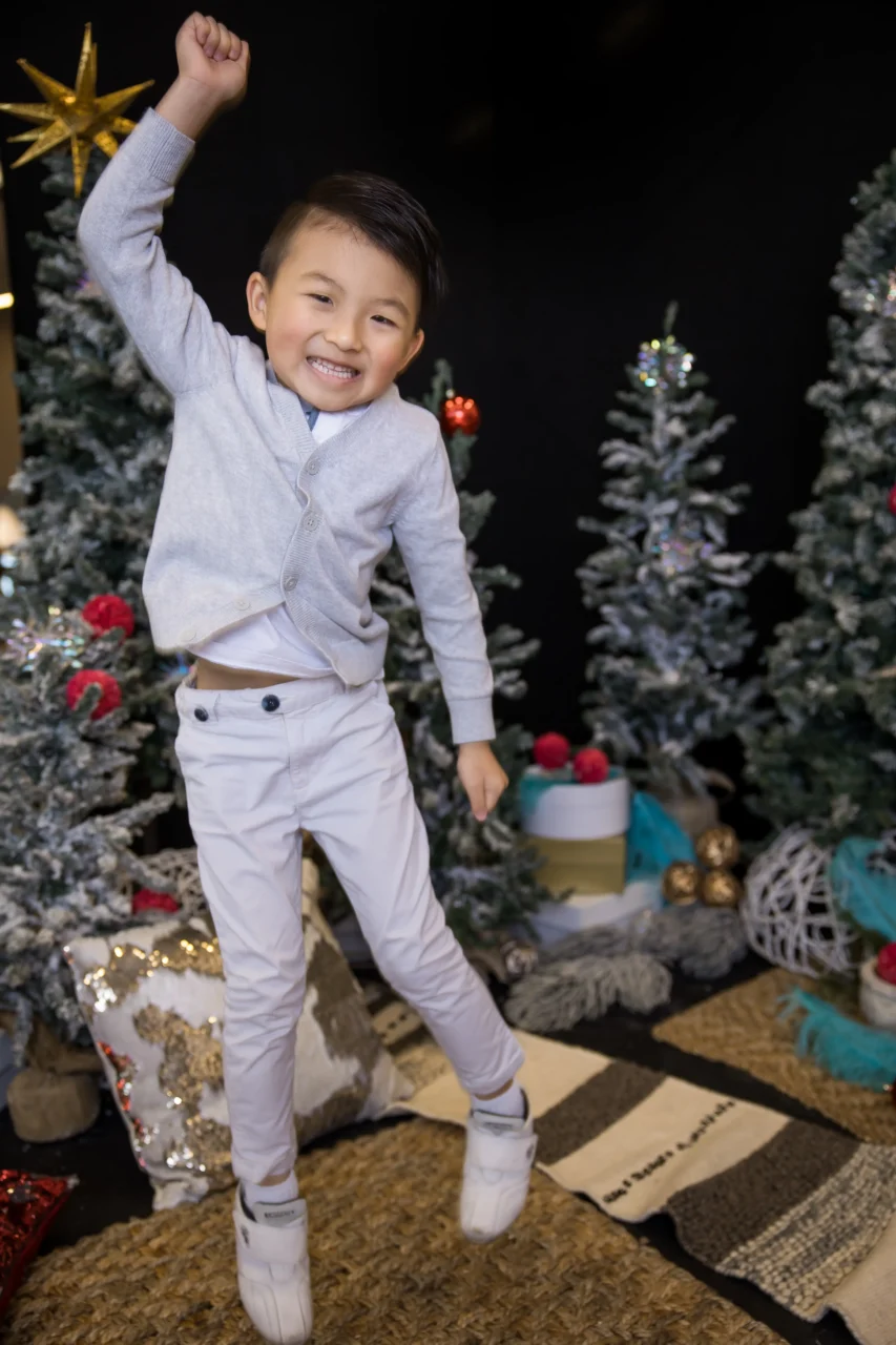 Edmonton Christmas mini session - boy jumping for joy by Paper Bunny Studios