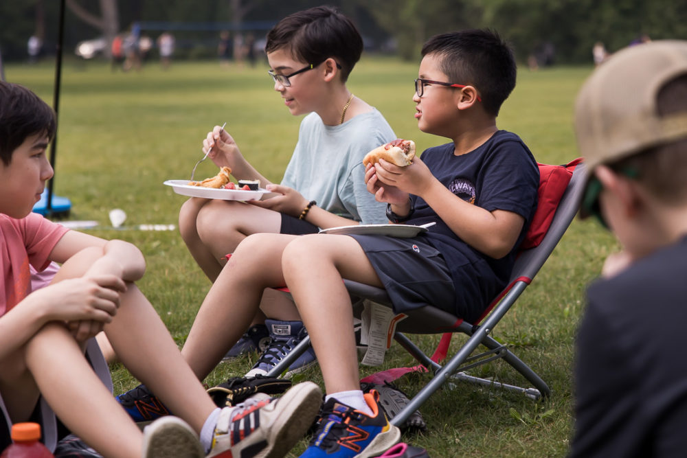 Documentary family reunion photography of kids enjoying food by Paper Bunny Studios Edmonton