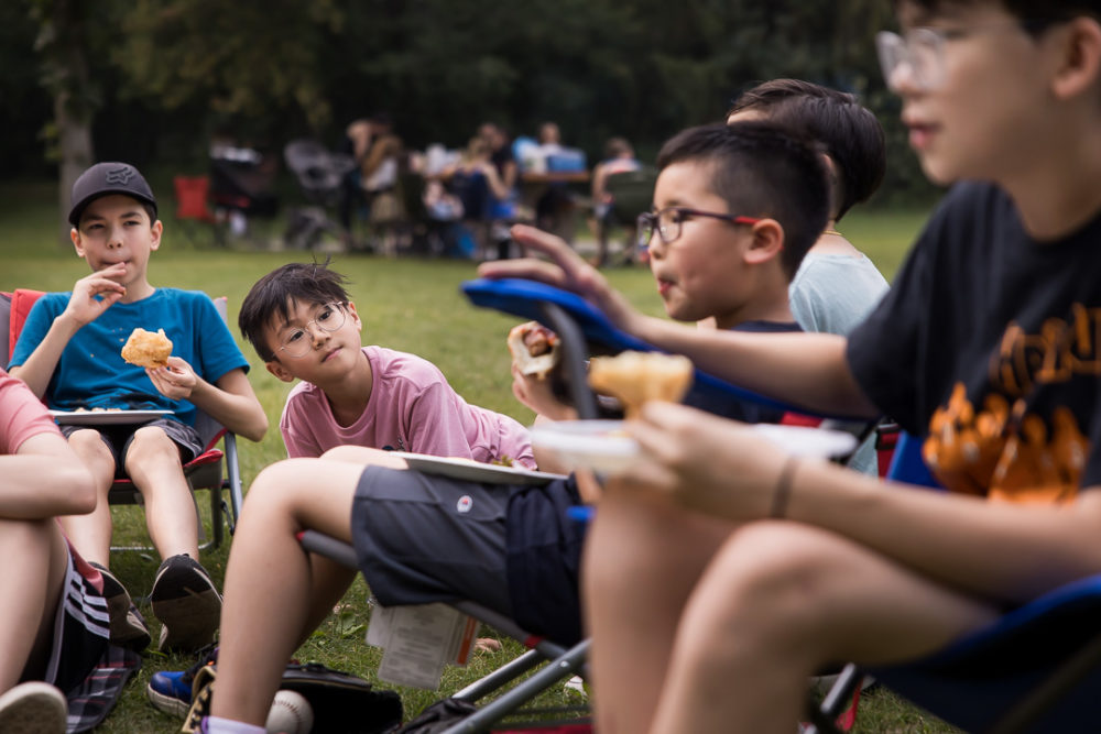 Documentary family reunion photography of kids eating by Paper Bunny Studios Edmonton