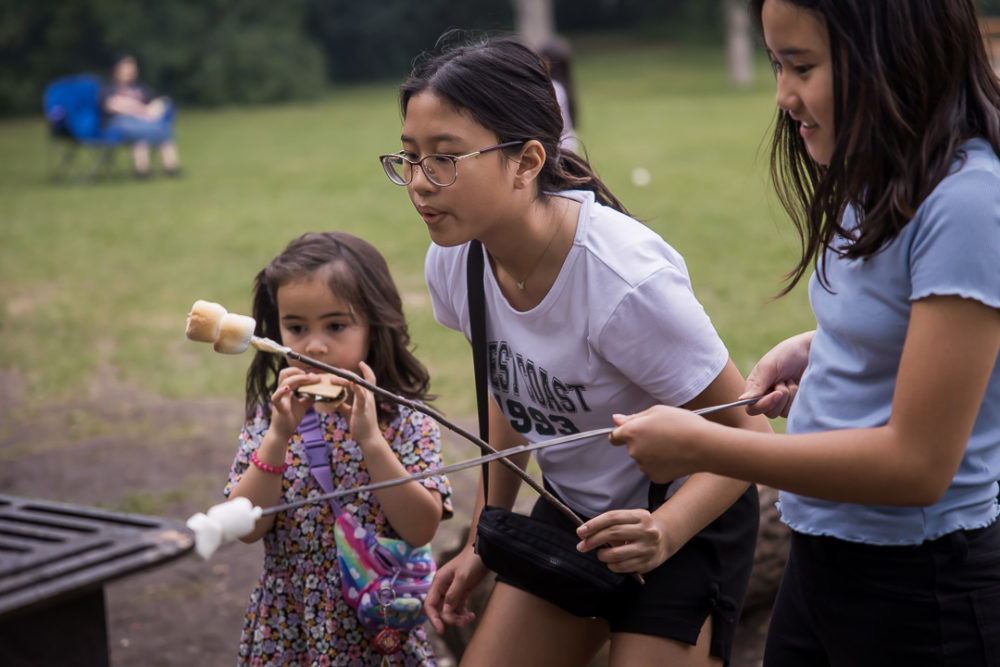 Documentary family reunion photography of marshmallow roasting by Paper Bunny Studios Edmonton