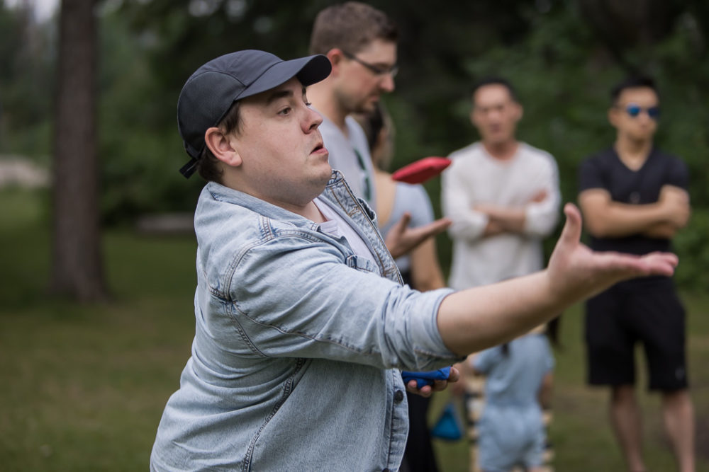 Documentary family reunion photography of bean bag throwing by Paper Bunny Studios Edmonton