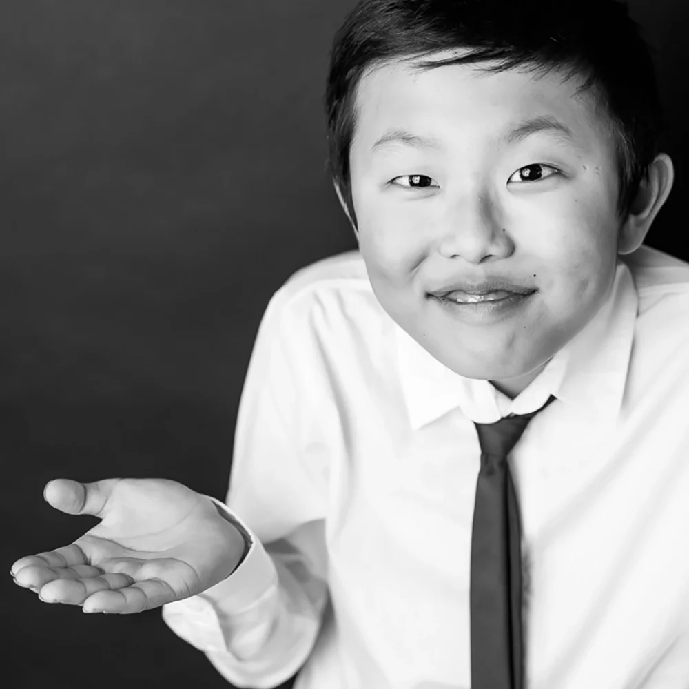 fun black and white portrait photo of young boy by Edmonton Family Photographer Paper Bunny Studios