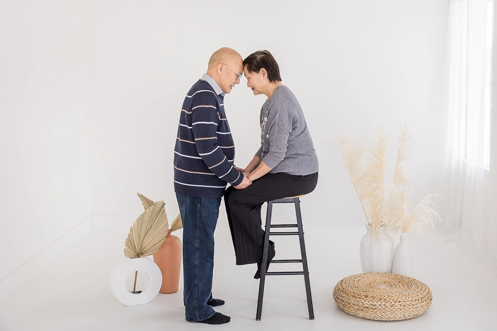 Edmonton extended family studio photos by Family Photographer Paper Bunny Studios portrait photo of grandparents with foreheads touching