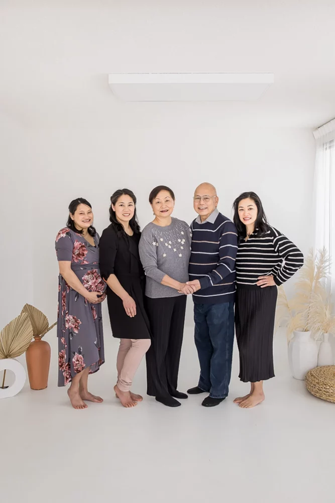 Portrait photo of parents and grown up daughters by Edmonton Family Photographer Paper Bunny Studios