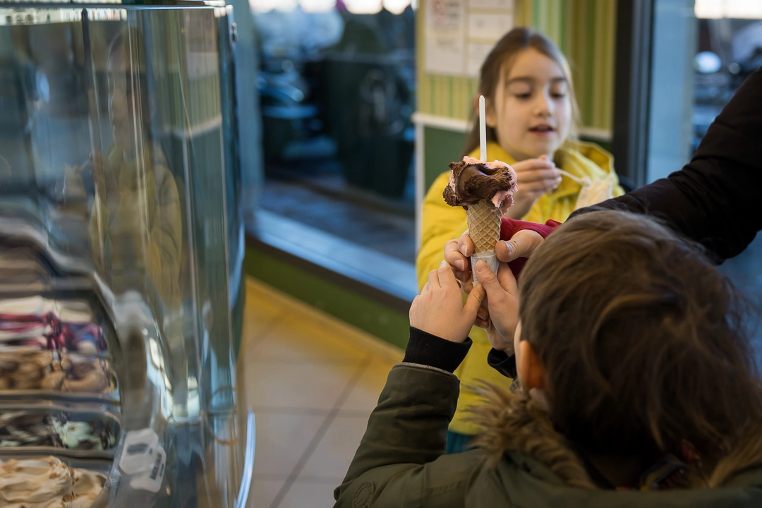 Kids eating gelato in Florence by Edmonton family photographer Paper Bunny Studios