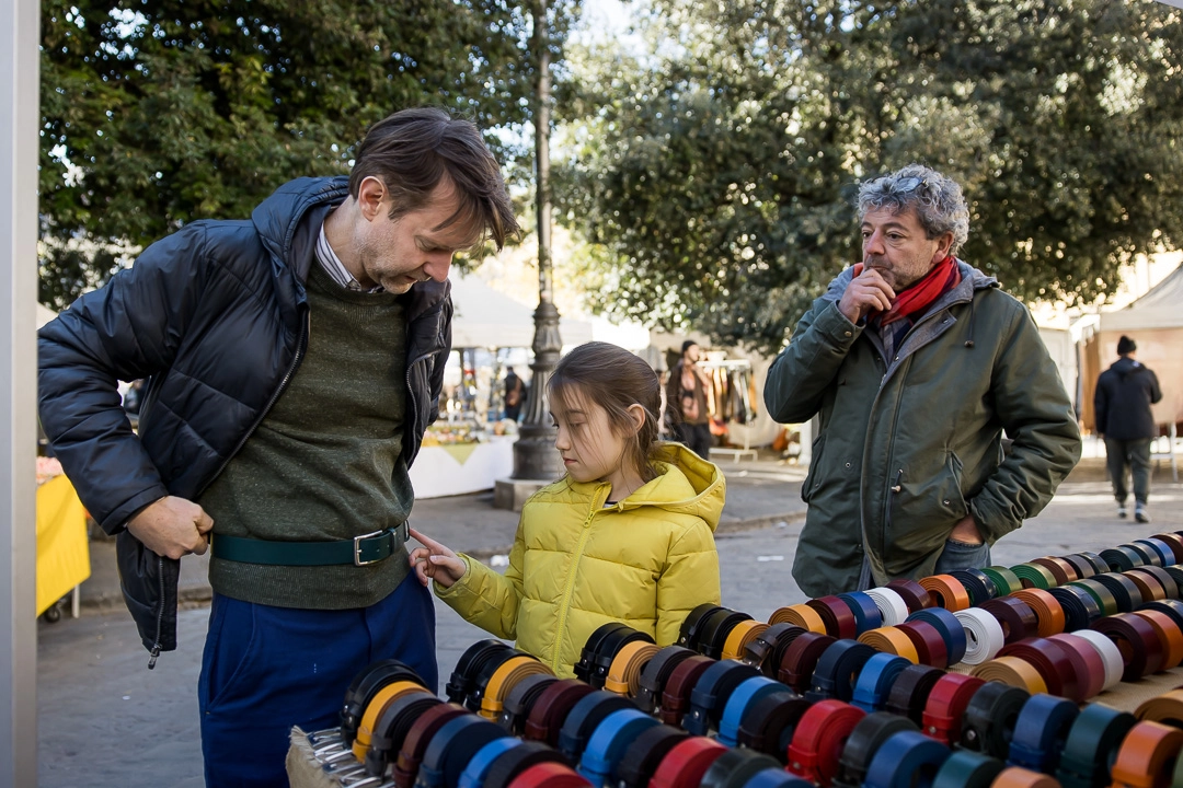 Dad & daughter shopping for belts in Florence by Edmonton family photographer Paper Bunny Studios