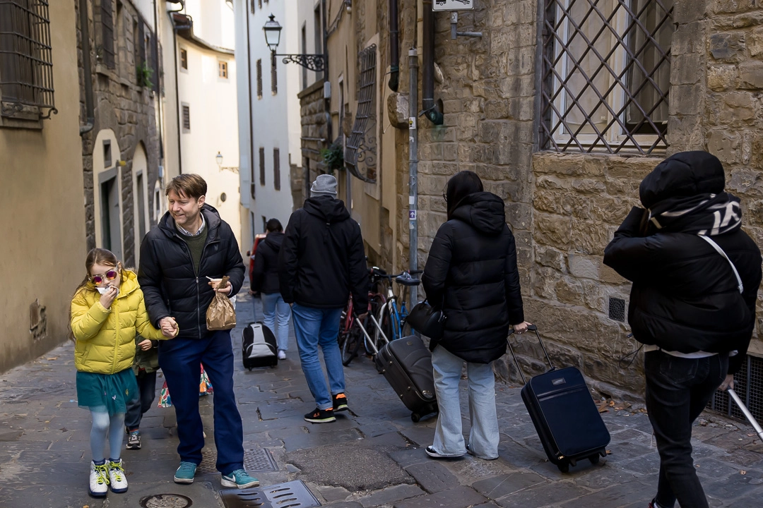 Dad & daughter walking along a street in Florence by Edmonton family photographer Paper Bunny Studios