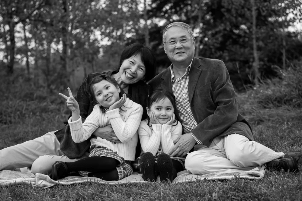 Black and white grandparents & grandkids outdoor portrait by Edmonton family photographer Paper Bunny Studios