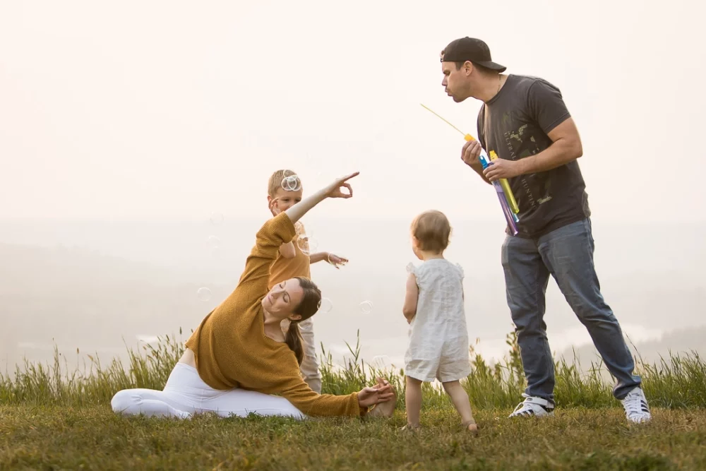 Documentary outdoor family photos including yoga by Edmonton family photographer Paper Bunny Studios