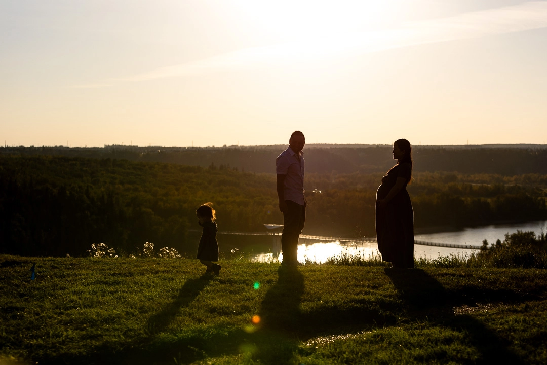 Sunset photo of family in river valley by Edmonton Family Photographer Paper Bunny Studios