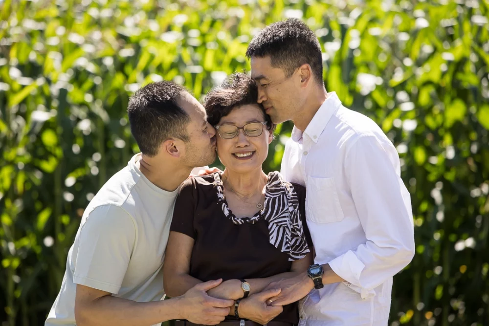 Sons kissing mom by Paper Bunny Studios Edmonton 