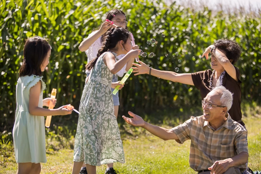 granddaughters playing with grandparents by Paper Bunny Studios Edmonton 