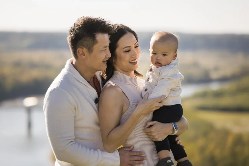 Close up outdoor family photo of parents with baby by Paper Bunny Studios Edmonton